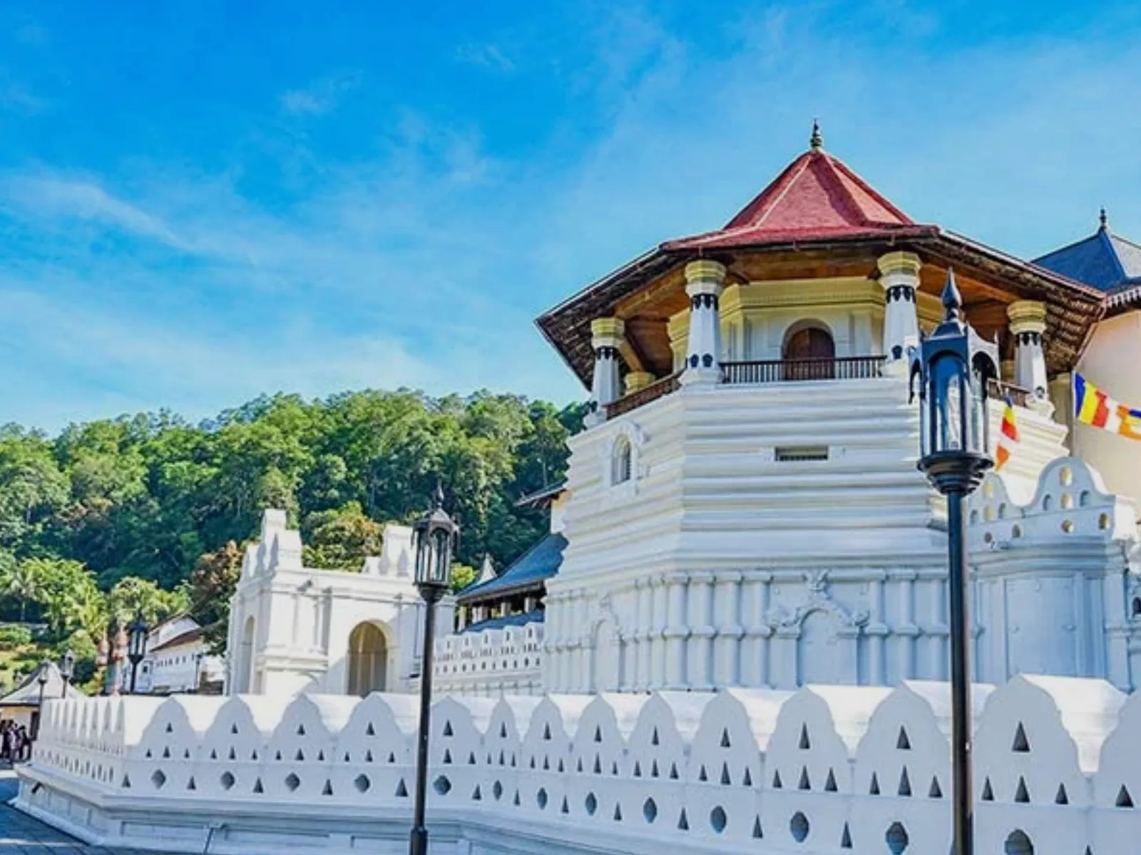 The illuminated Temple of the Sacred Tooth Relic in Kandy at dusk