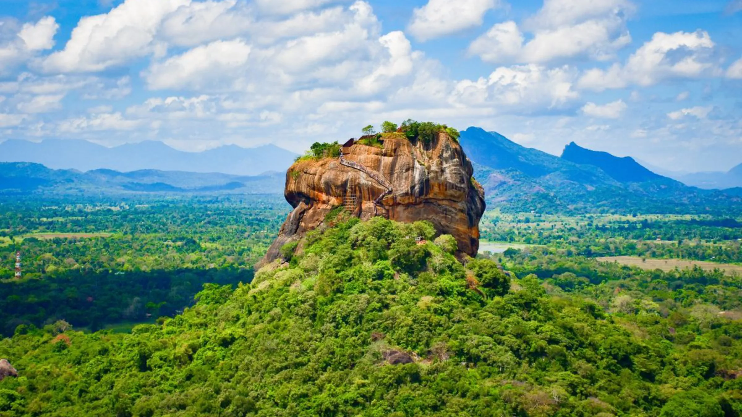 The ancient rock fortress of Sigiriya rising above the surrounding jungle